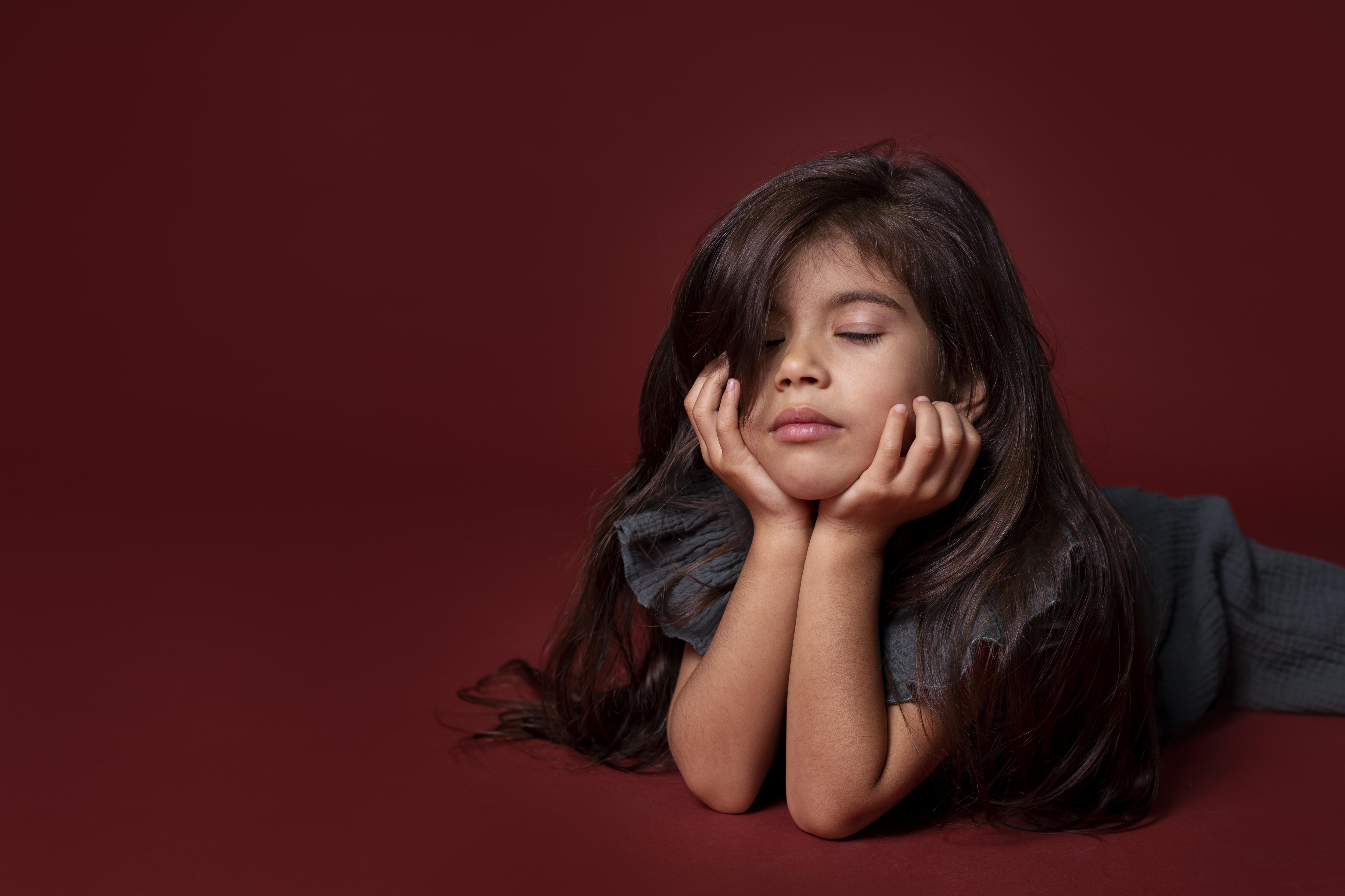 little asian girl looking sleepy with copy space